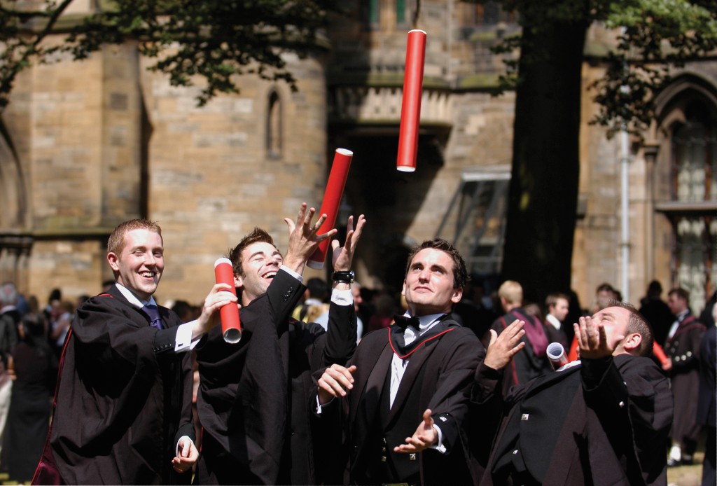 Glasgow University Graduation - graduates throwing scrolls into air
